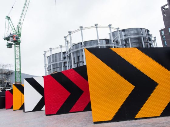 A street scene with brightly coloured hoardings