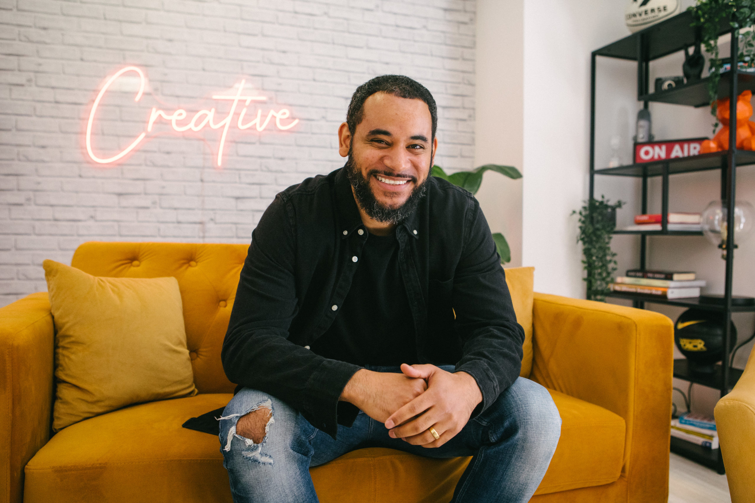 Man sitting on sofa and smiling