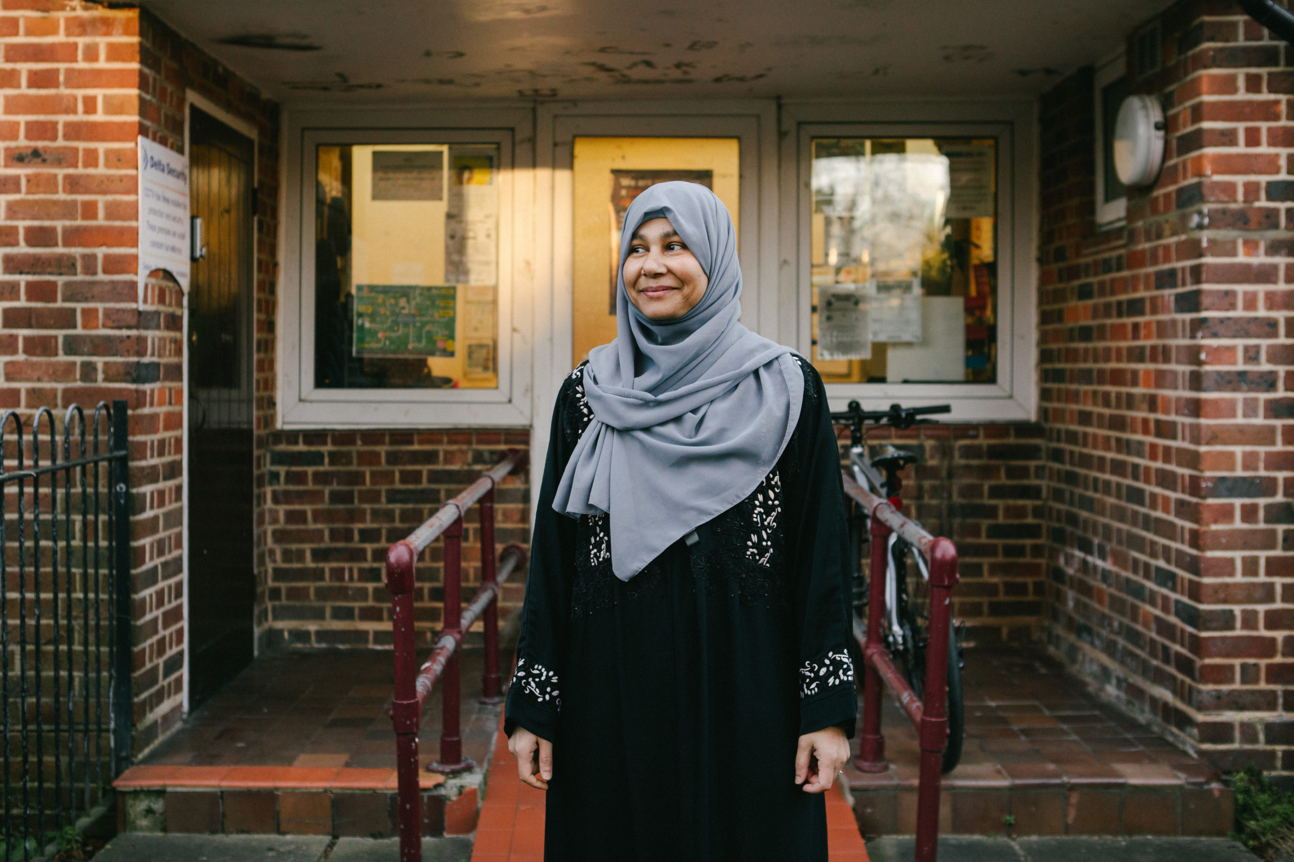 Woman standing outside community centre