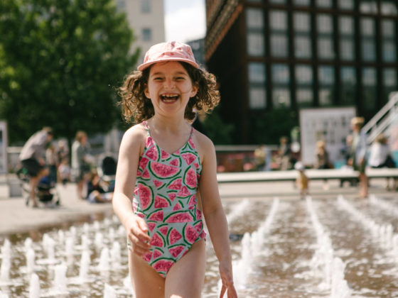 Girl playing in fountains