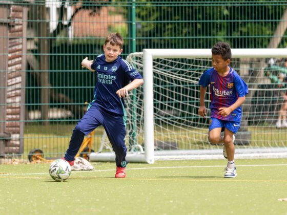 Two boys playing football