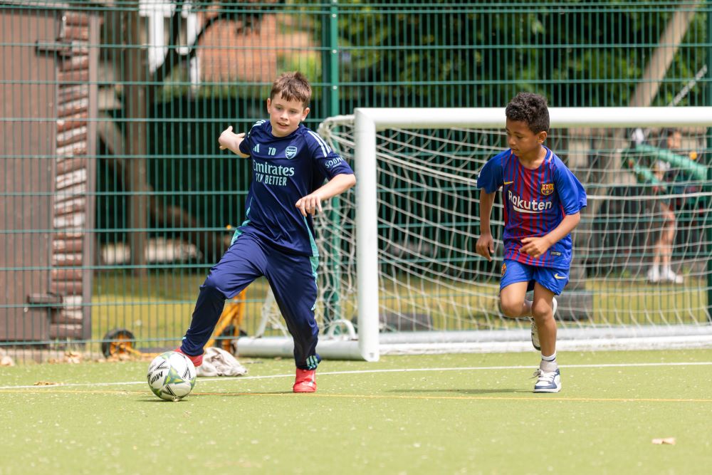 Two boys playing football