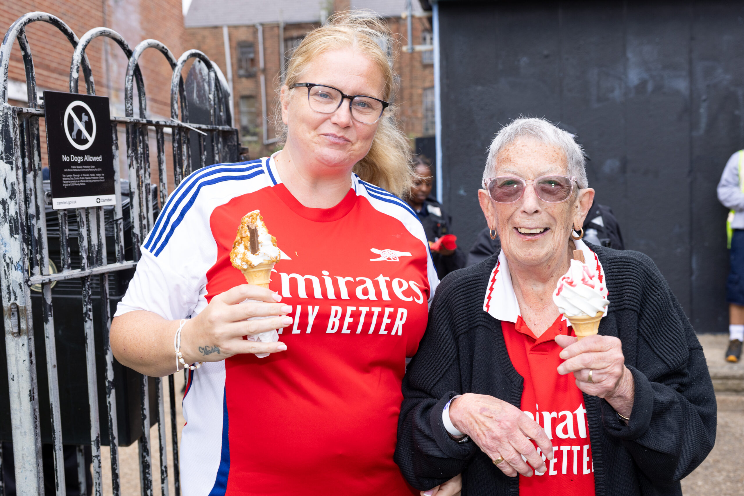 two local residents at the event eating ice-cream